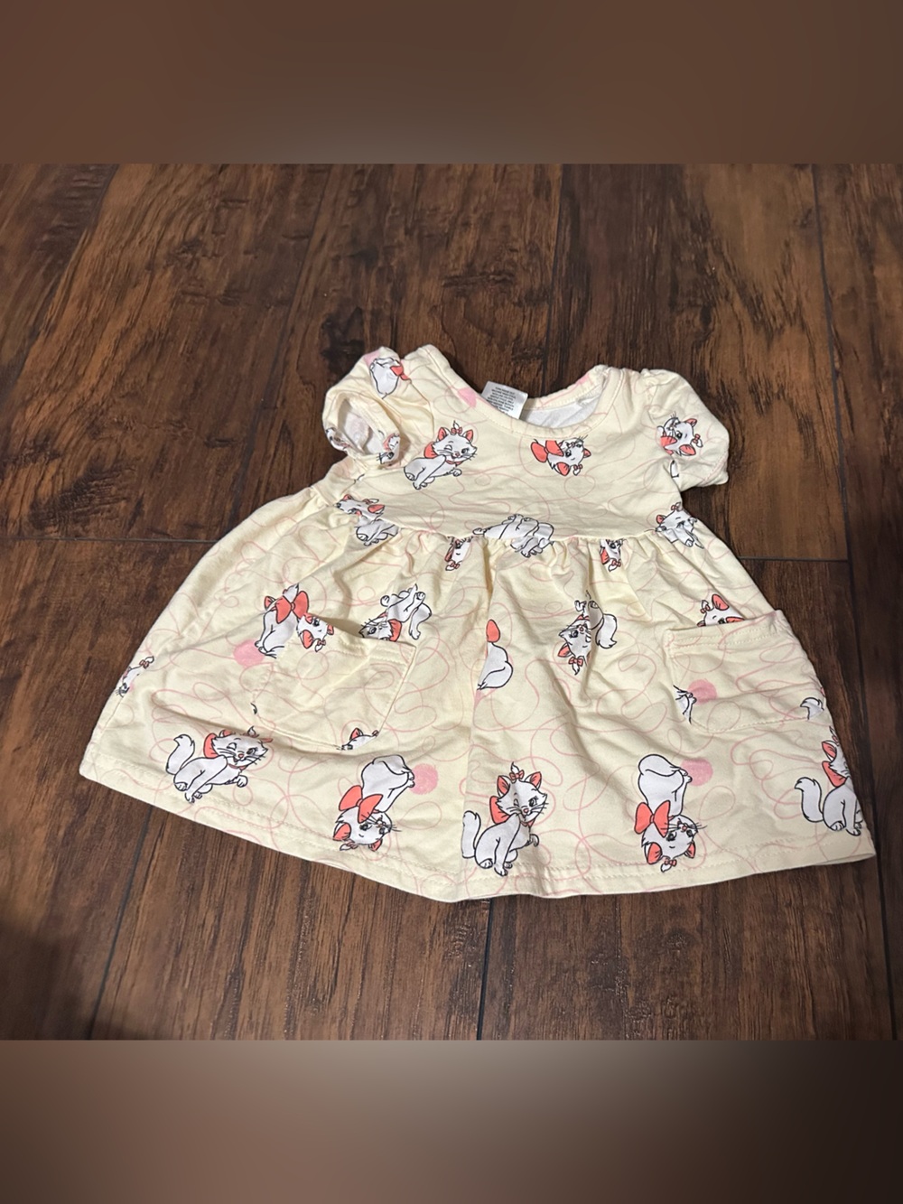 Cream Kids Dress with Aristrocat Print and Pink Accents